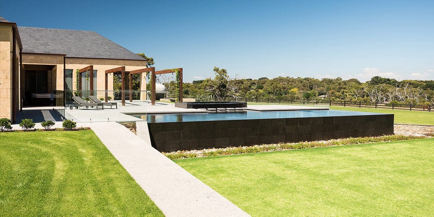 Luxury swimming pool and granite paving at Narre Warren North landscaping project